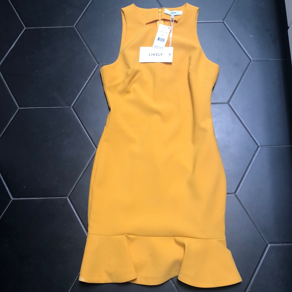 Likely yellow dress from Saks. NWT